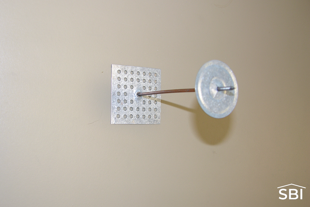 metal-building-stick-pin